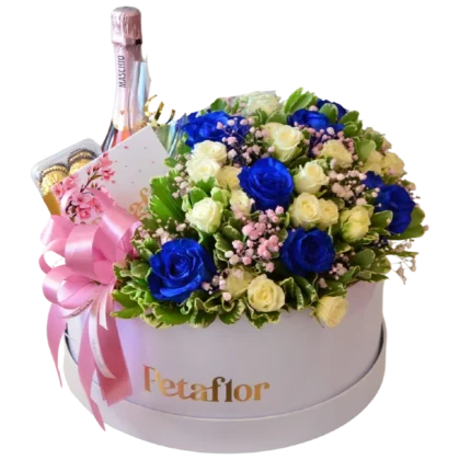 MF19: Caja circular blanca con rosas azules y blancas, botella de vino Maschio y Ferrero.
